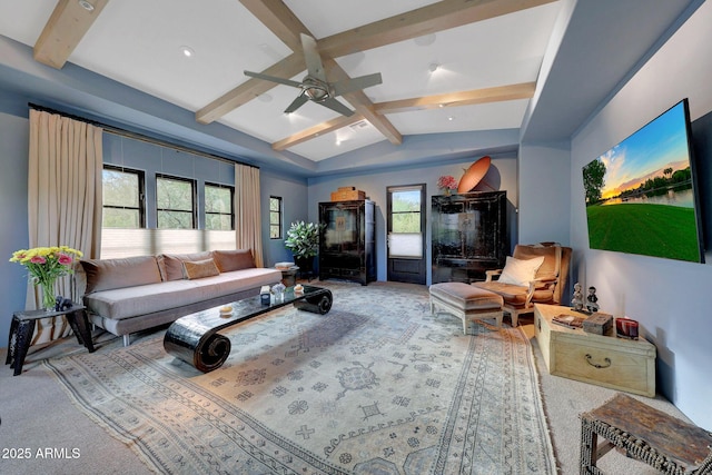 living room with carpet, lofted ceiling with beams, plenty of natural light, and ceiling fan