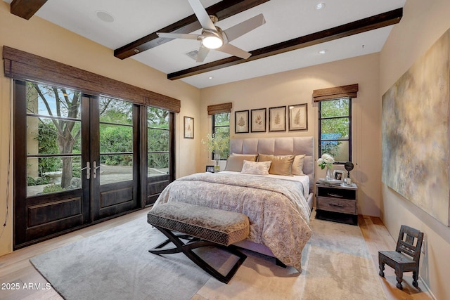 bedroom featuring beamed ceiling, ceiling fan, access to outside, and french doors