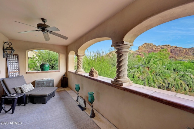 view of patio / terrace featuring a balcony and ceiling fan