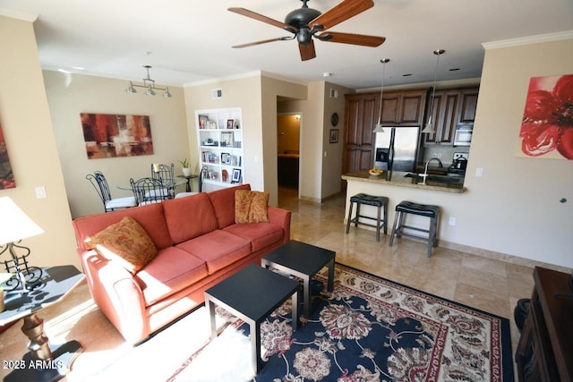 5345 E Van Buren St Unit 115, Phoenix, AZ 85008 - living area featuring crown molding, ceiling fan, light tile patterned floors, and a chandelier