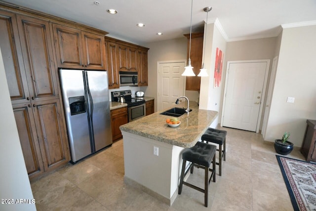 5345 E Van Buren St Unit 115, Phoenix, AZ 85008 - kitchen featuring appliances with stainless steel finishes, a sink, a breakfast bar, ornamental molding, and a peninsula