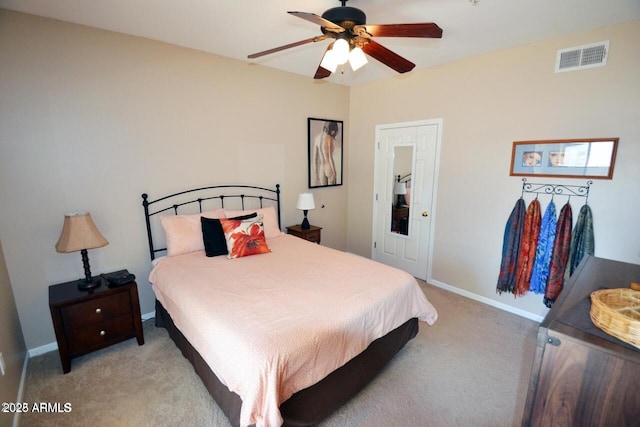 5345 E Van Buren St Unit 115, Phoenix, AZ 85008 - bedroom featuring light colored carpet, baseboards, and ceiling fan