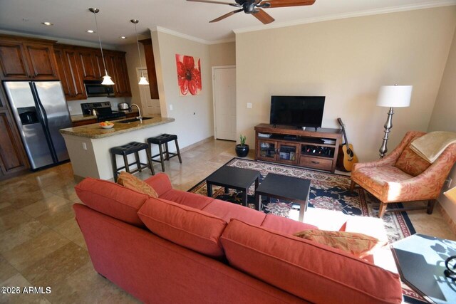 5345 E Van Buren St Unit 115, Phoenix, AZ 85008 - living area featuring crown molding, a ceiling fan, recessed lighting, and baseboards