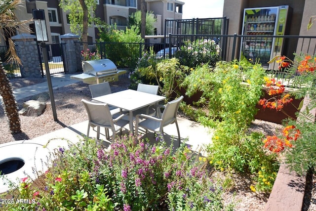 5345 E Van Buren St Unit 115, Phoenix, AZ 85008 - view of patio featuring outdoor dining space and area for grilling
