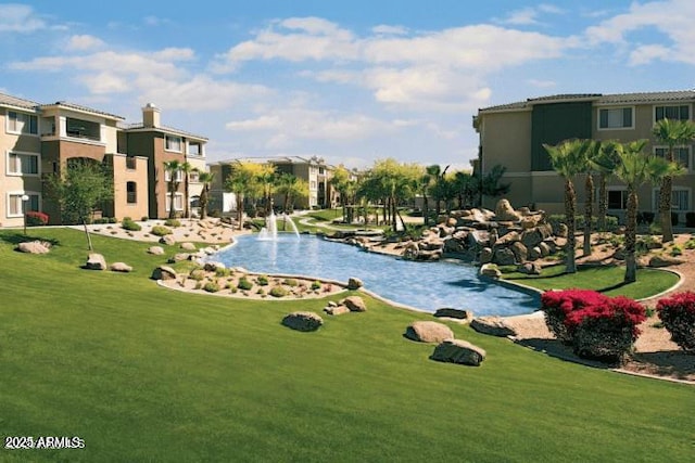5345 E Van Buren St Unit 115, Phoenix, AZ 85008 - view of community with a lawn