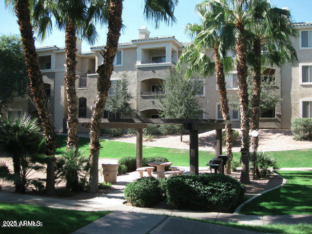 5345 E Van Buren St Unit 115, Phoenix, AZ 85008 - view of community featuring a yard