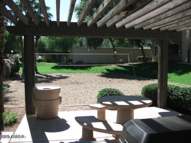 5345 E Van Buren St Unit 115, Phoenix, AZ 85008 - view of patio featuring a pergola