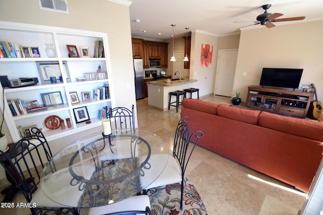 5345 E Van Buren St Unit 115, Phoenix, AZ 85008 - living room with a ceiling fan, crown molding, and recessed lighting