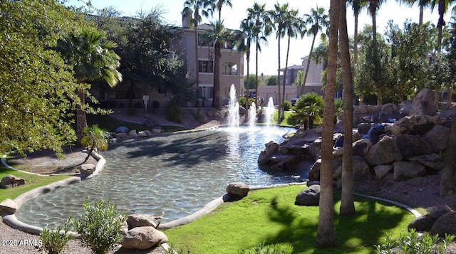 5345 E Van Buren St Unit 115, Phoenix, AZ 85008 - view of property's community with a garden pond