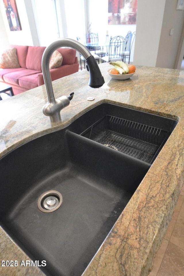 5345 E Van Buren St Unit 115, Phoenix, AZ 85008 - kitchen view of a sink and stone countertops