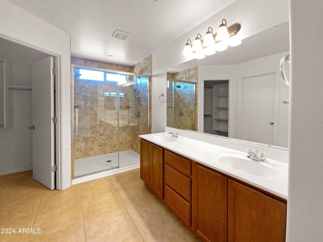 bathroom with vanity, tile patterned floors, and a shower with shower door