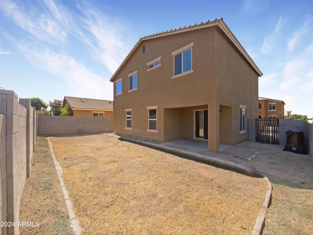 rear view of house featuring a patio area