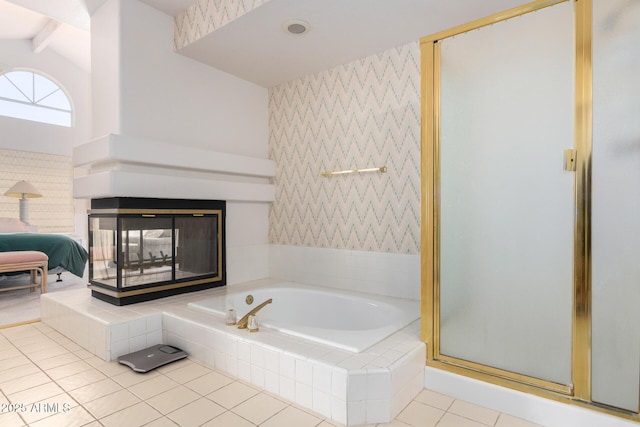 bathroom with shower with separate bathtub, tile patterned flooring, and vaulted ceiling