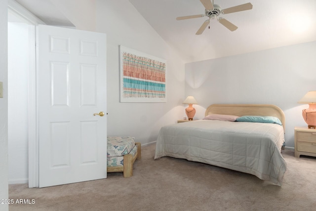 carpeted bedroom featuring ceiling fan and vaulted ceiling