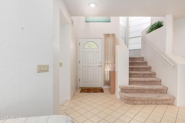 entrance foyer with light tile patterned flooring