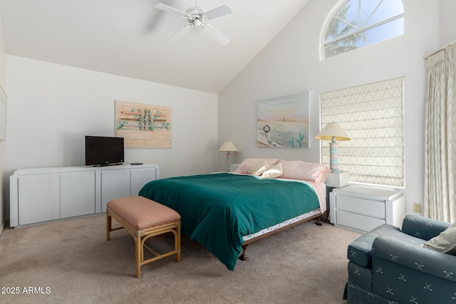 carpeted bedroom with high vaulted ceiling and ceiling fan