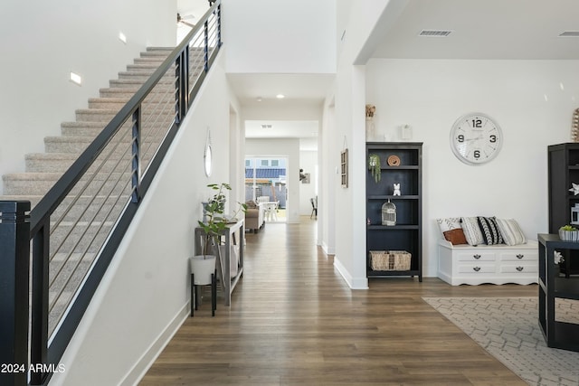 foyer entrance featuring dark hardwood / wood-style floors