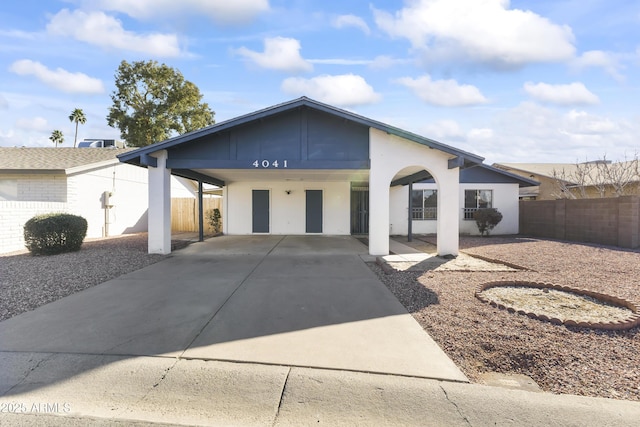 single story home with a carport