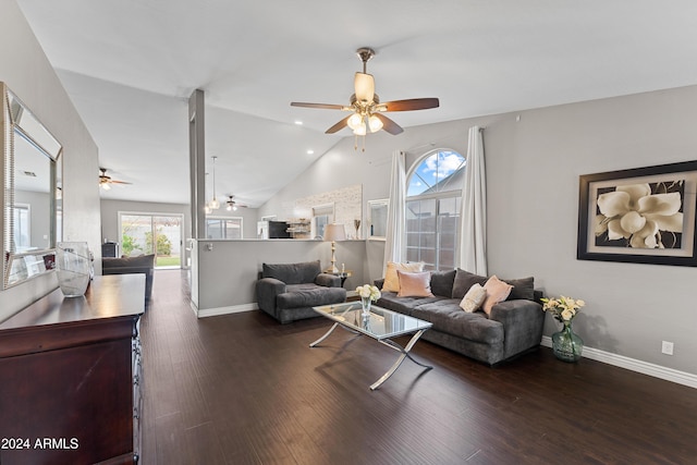 living room featuring vaulted ceiling and dark hardwood / wood-style floors