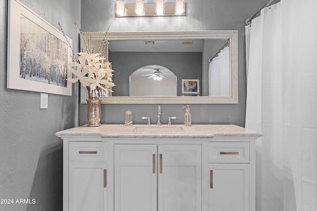 bathroom with ceiling fan and vanity