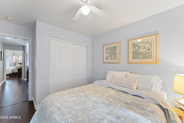 bedroom with ceiling fan, a closet, and dark hardwood / wood-style floors