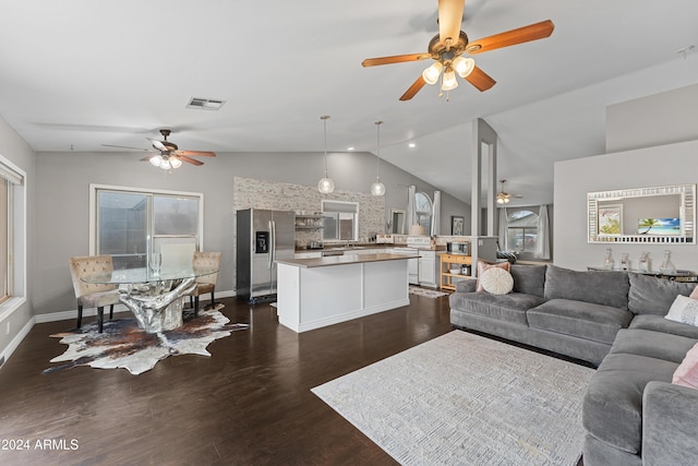 living room with lofted ceiling and dark hardwood / wood-style floors