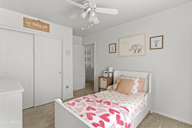 3211 E Kerry Ln, Phoenix, AZ 85050 - bedroom with light colored carpet, a closet, and a ceiling fan