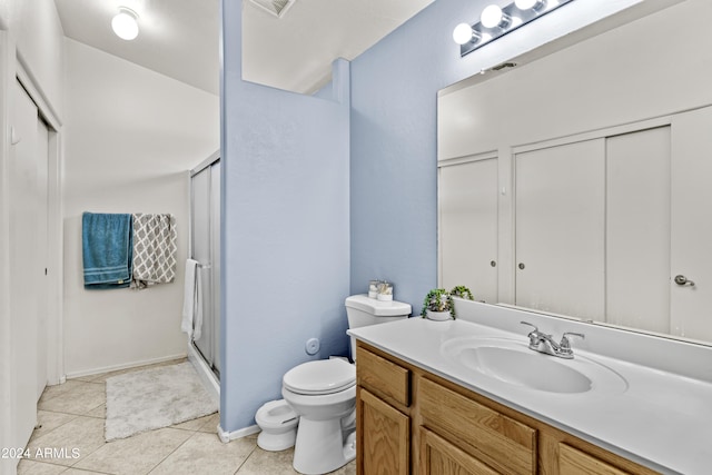 3211 E Kerry Ln, Phoenix, AZ 85050 - bathroom with vanity, toilet, tile patterned flooring, and a shower stall