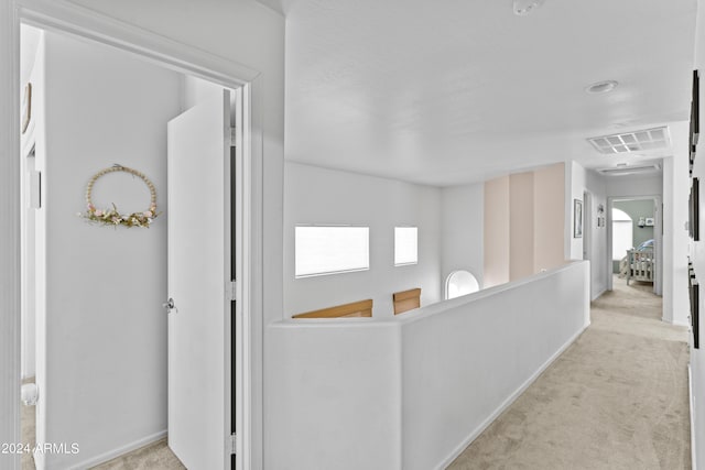 3211 E Kerry Ln, Phoenix, AZ 85050 - hall with light carpet, baseboards, and visible vents