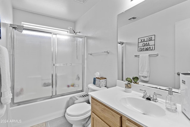 3211 E Kerry Ln, Phoenix, AZ 85050 - bathroom with toilet, vanity, enclosed tub / shower combo, and visible vents