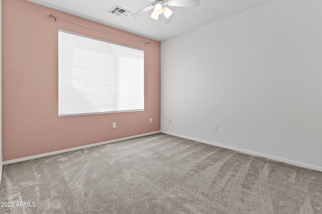 3211 E Kerry Ln, Phoenix, AZ 85050 - spare room with baseboards, visible vents, ceiling fan, and carpet flooring