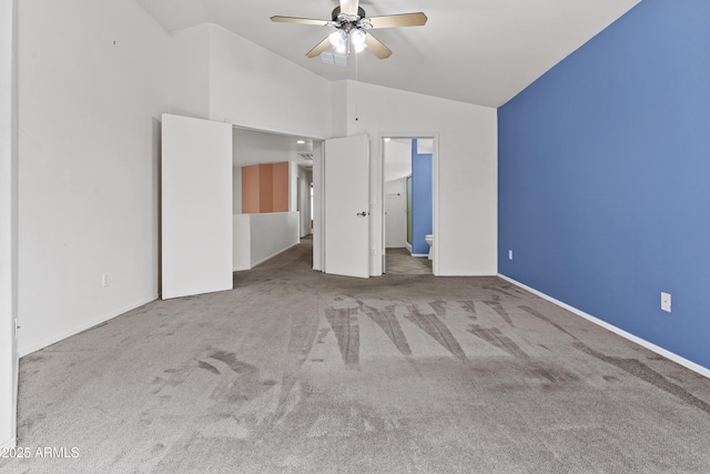 3211 E Kerry Ln, Phoenix, AZ 85050 - unfurnished bedroom featuring baseboards, lofted ceiling, and carpet flooring