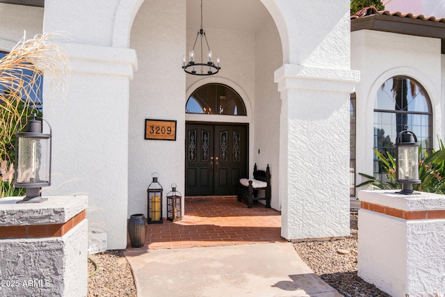 doorway to property with stucco siding
