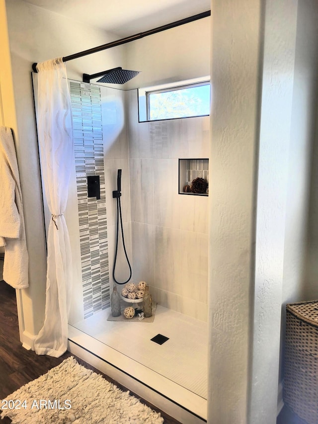 bathroom featuring a shower with curtain and wood-type flooring