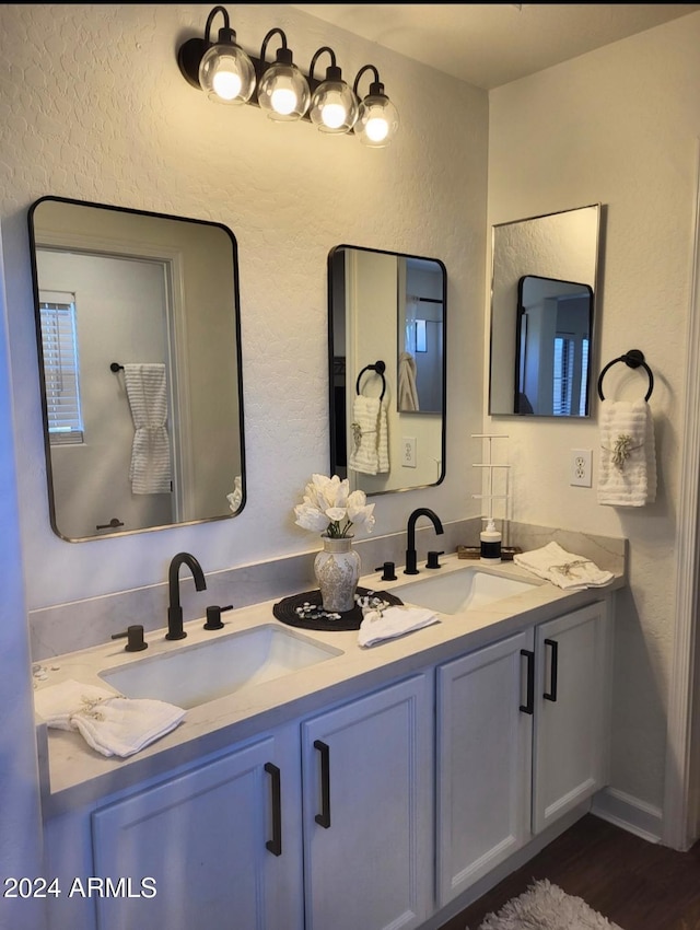 bathroom featuring vanity and hardwood / wood-style flooring