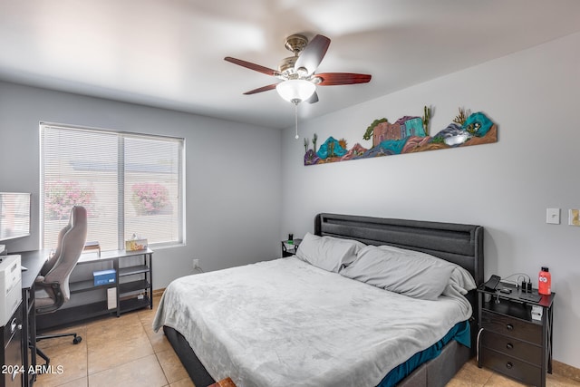 bedroom featuring light tile patterned floors and ceiling fan