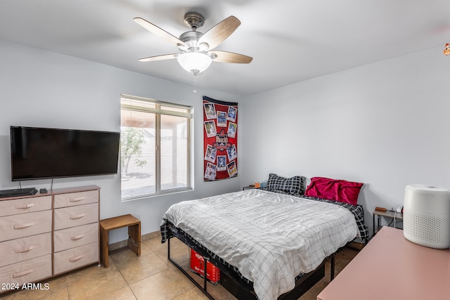 bedroom featuring light tile patterned flooring and ceiling fan