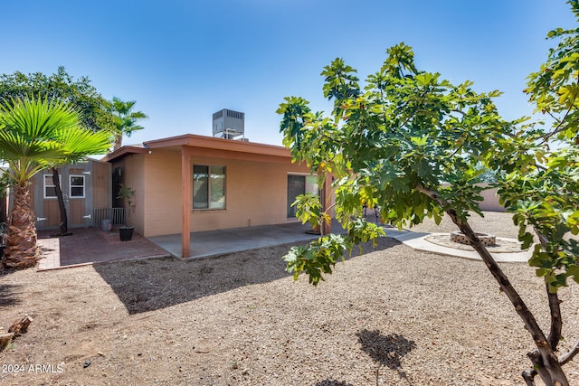 back of house with a patio area