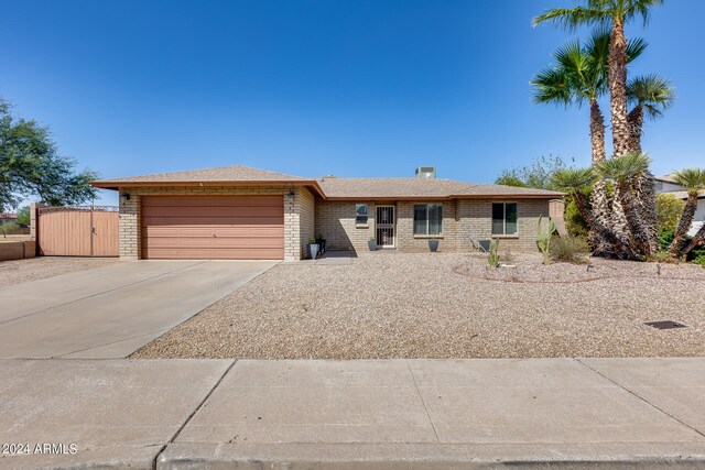 ranch-style home with a garage