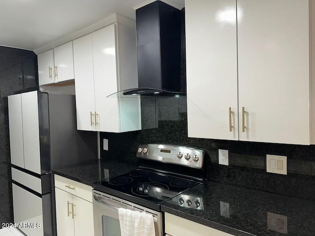 kitchen with white cabinets, wall chimney exhaust hood, decorative backsplash, and appliances with stainless steel finishes