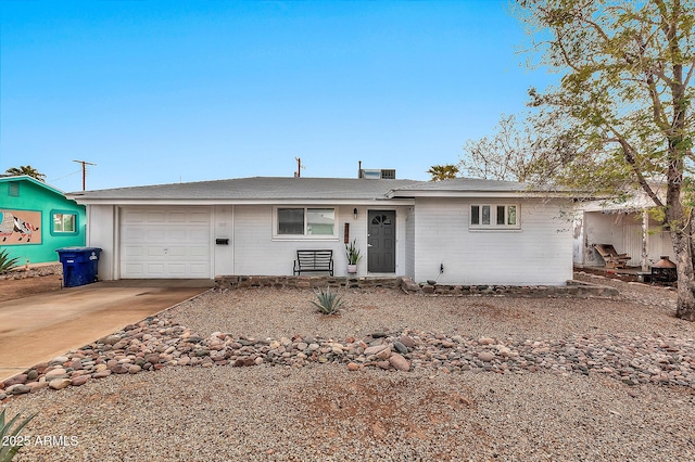 ranch-style home featuring a garage