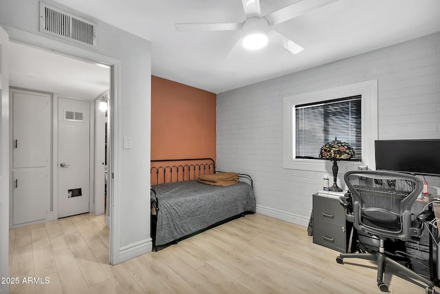 bedroom featuring ceiling fan and light hardwood / wood-style flooring