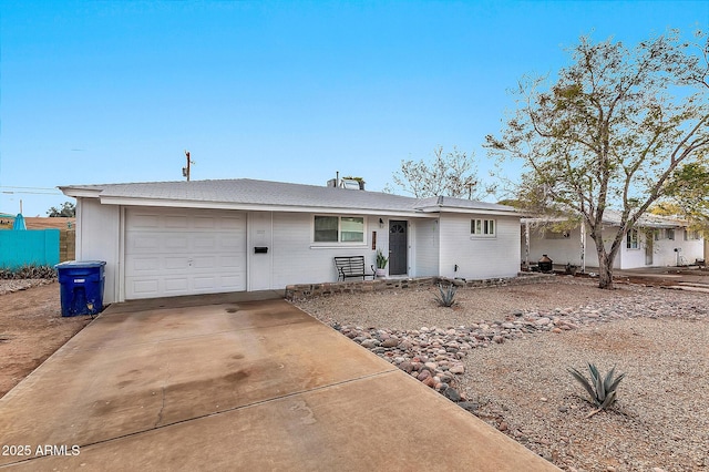 ranch-style home featuring a garage