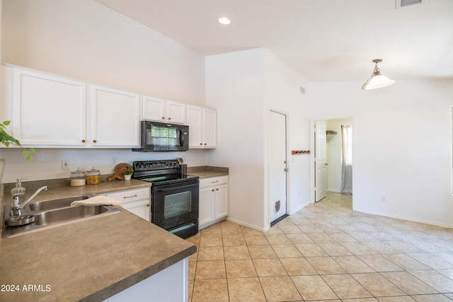 kitchen featuring white cabinetry, sink, hanging light fixtures, and black appliances