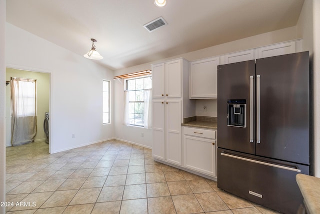 kitchen featuring pendant lighting, high quality fridge, white cabinets, and lofted ceiling