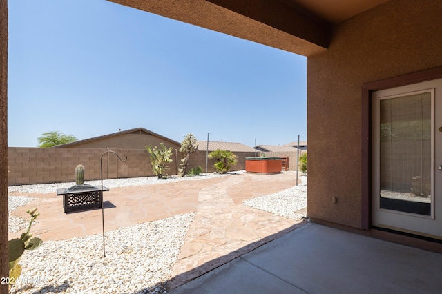 view of patio / terrace featuring a hot tub