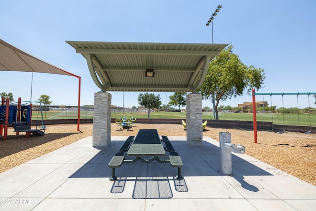 view of property's community with a playground