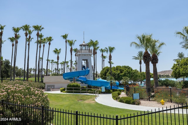 view of property's community featuring a yard