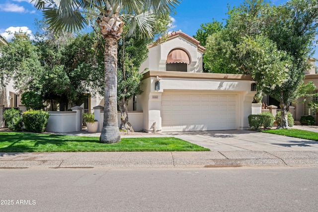 view of front of home featuring driveway, fence, and stucco siding