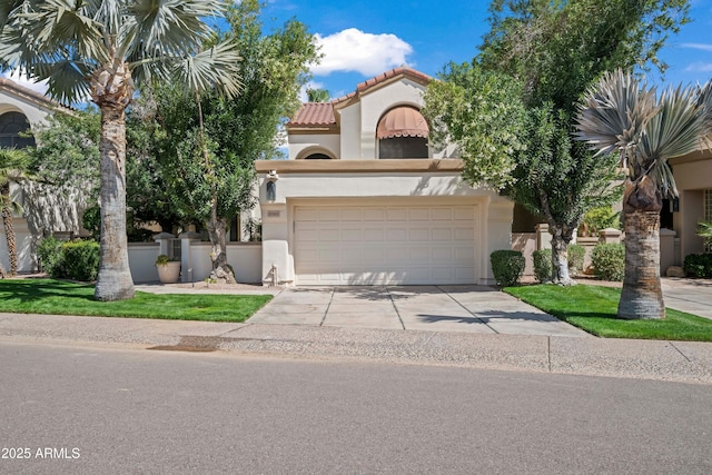 view of front of property featuring driveway, fence, a tile roof, and stucco siding